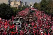 The truck carrying the coffins of the slain Iranian Supreme Leader Ayatollah Ali Khamenei and members of his family makes its way through mourners during the funeral procession toward Azadi Tower in Tehran, Iran, Monday, July 6, 2026. (AP Photo/Vahid Salemi) Associate Press/ LaPresse Only Italy and Spain