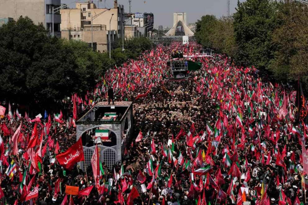 The truck carrying the coffins of the slain Iranian Supreme Leader Ayatollah Ali Khamenei and members of his family makes its way through mourners during the funeral procession toward Azadi Tower in Tehran, Iran, Monday, July 6, 2026. (AP Photo/Vahid Salemi) Associate Press/ LaPresse Only Italy and Spain